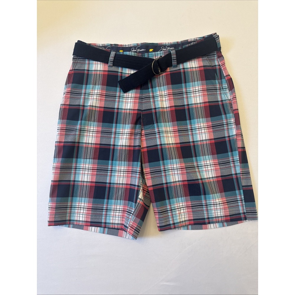 Jack Nicklaus men's golf shorts feature a navy plaid  w/ cloth belt